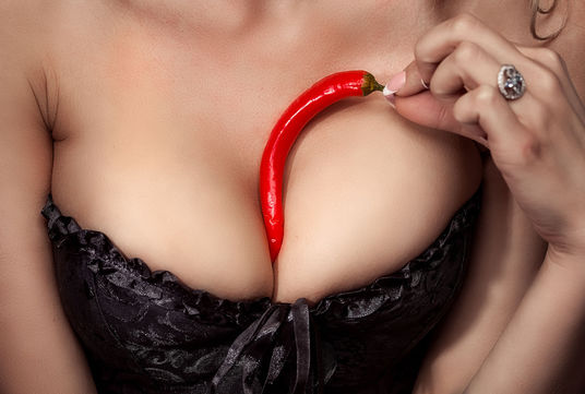 33103911 - sexy woman with red chili pepper